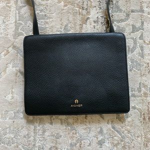 AIGNER black leather crossbody bag.